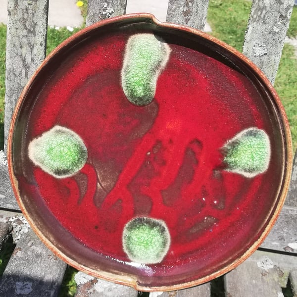 Stoneware brilliant crackle red glazed plate with green glass melt