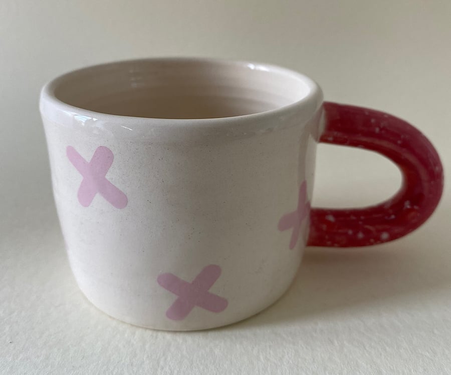 Pink crosses handmade ceramic mug.
