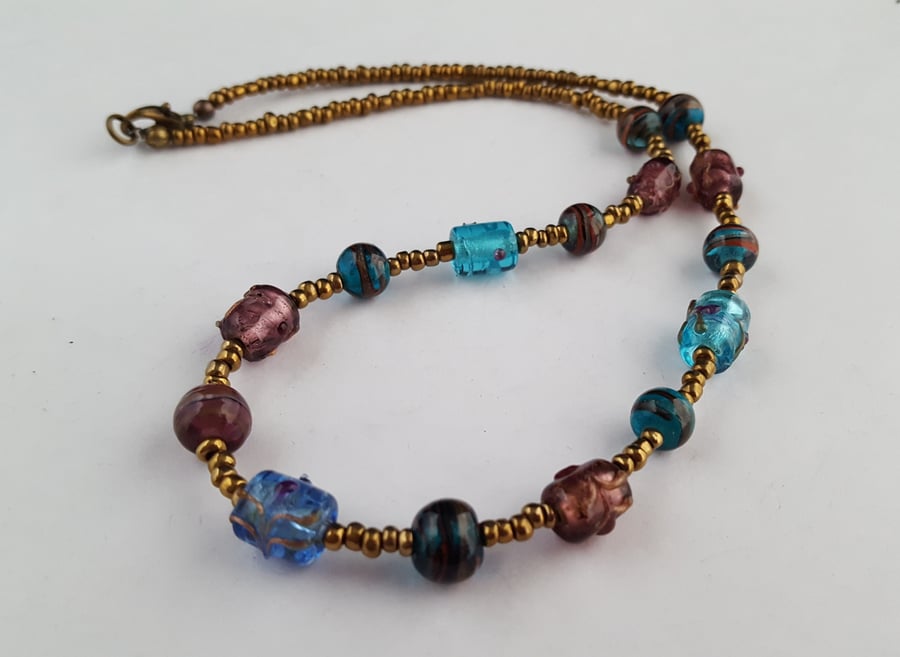 Blue and bronzy brown glass bead necklace - 1002486