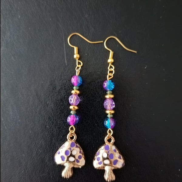 Purple and blue beaded cottage core dangle earrings with toadstool charms 