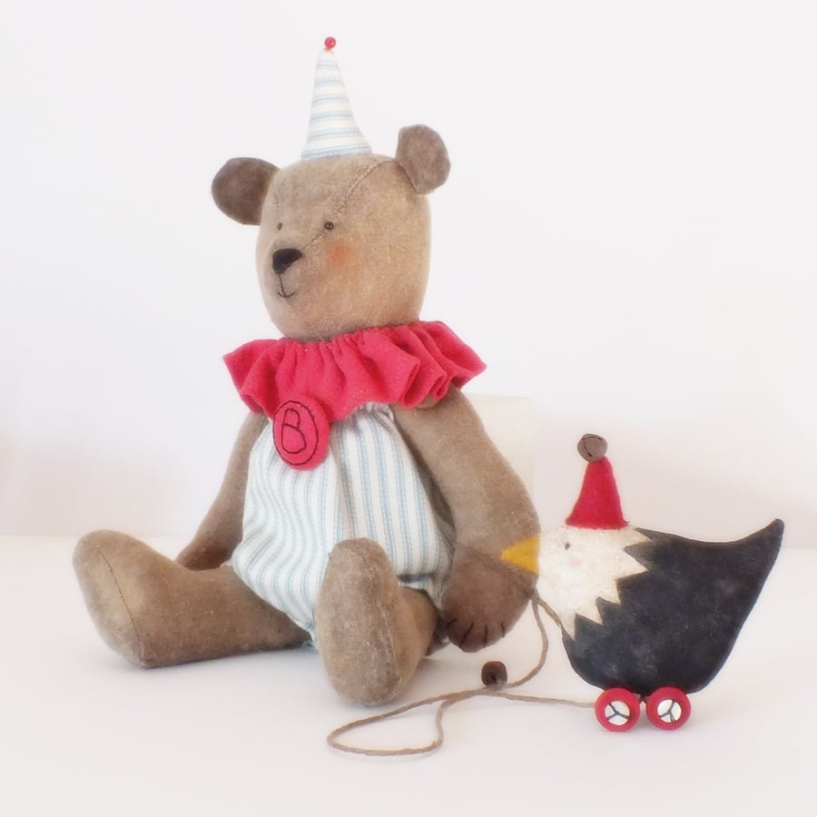 Primitive dressed bear and chicken