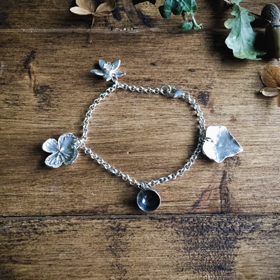 Sterling silver charm bracelet with four seasons charms - daffodil, ivy, acorm