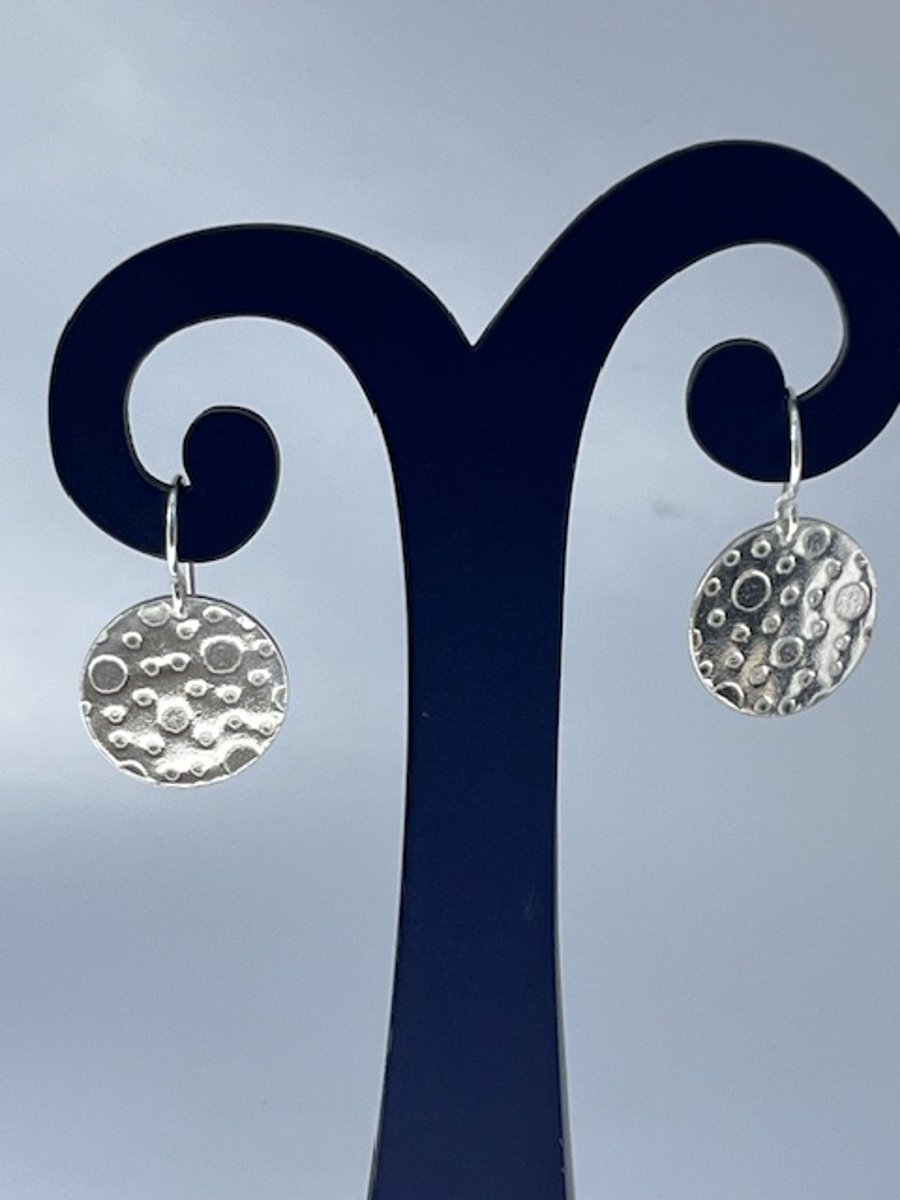 Silver disc earrings with bubbles texture
