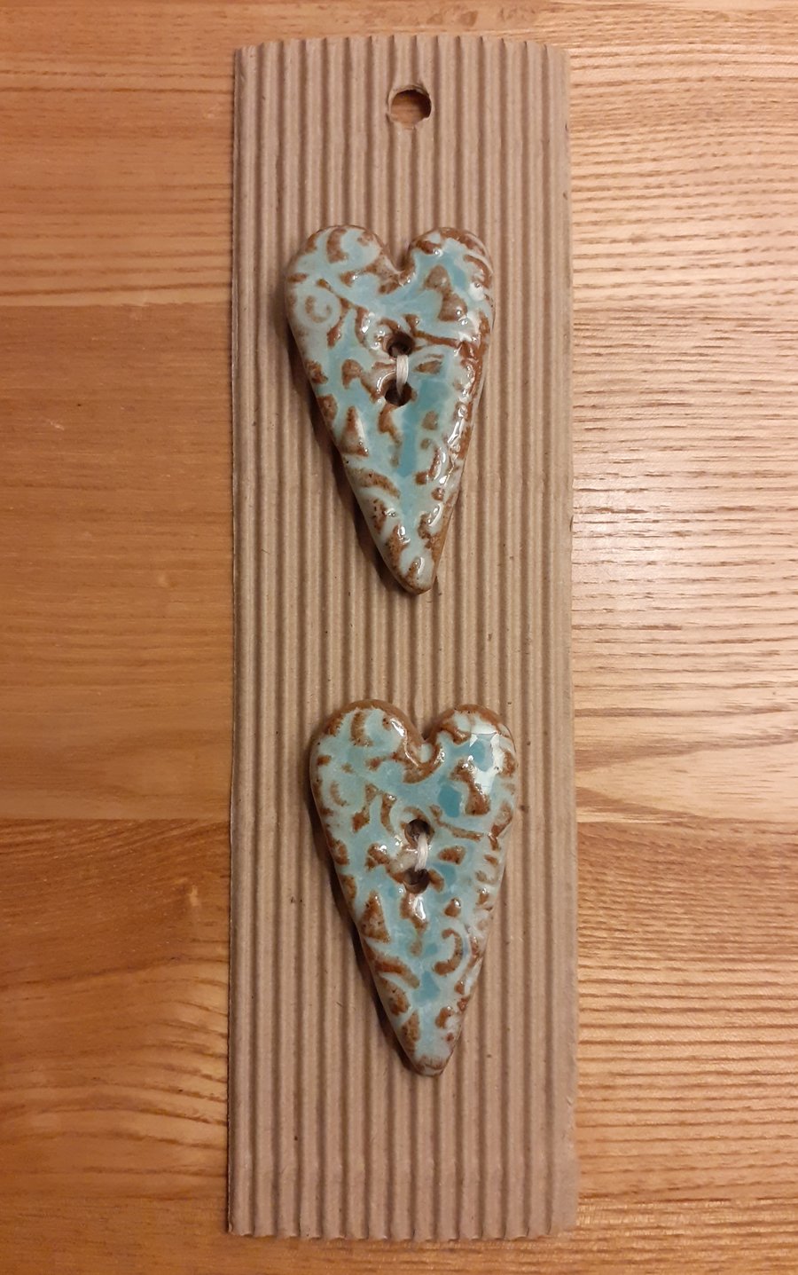 Long patterned ceramic heart buttons