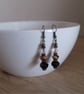RED AND ANTIQUE BRONZE EARRINGS. - Image 3