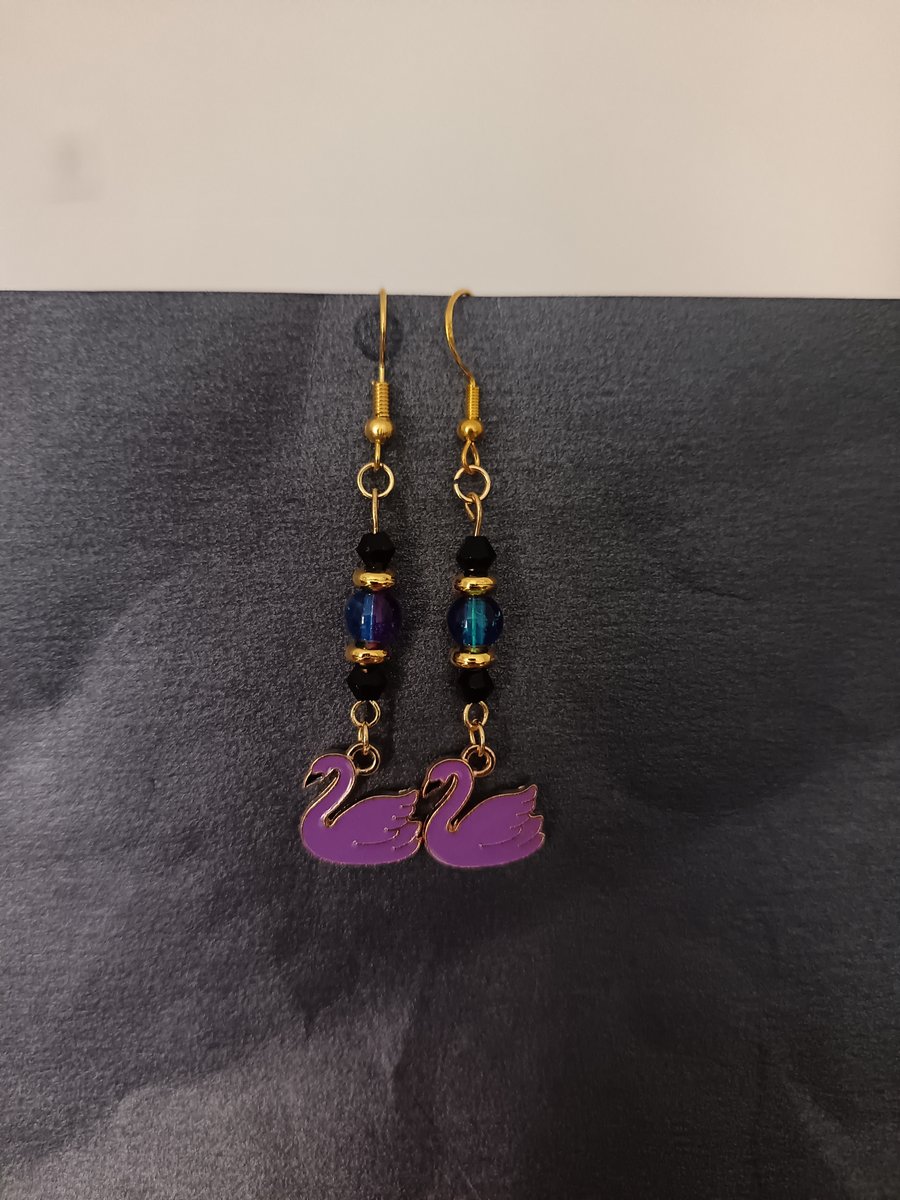 Purple and black beaded swan charm dangle earrings 