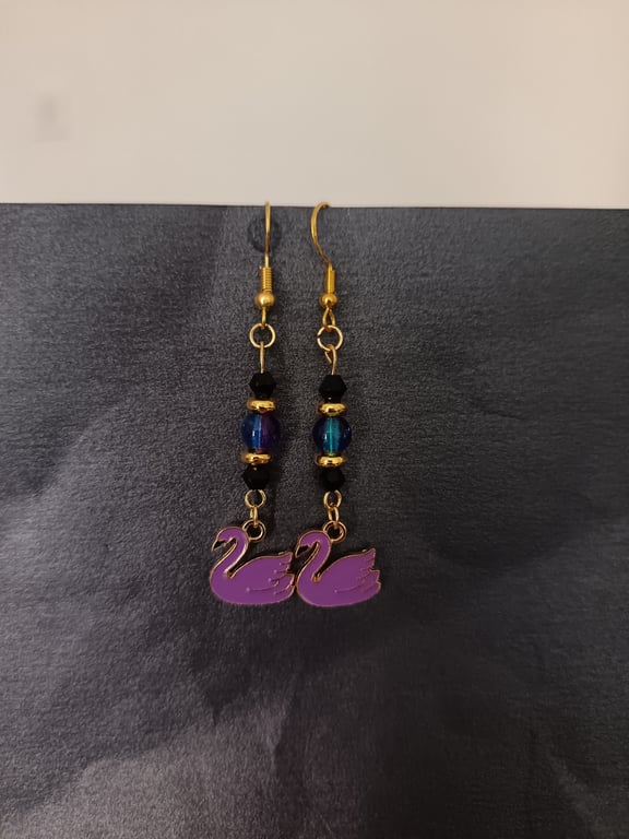 Purple and black beaded swan charm dangle earrings 