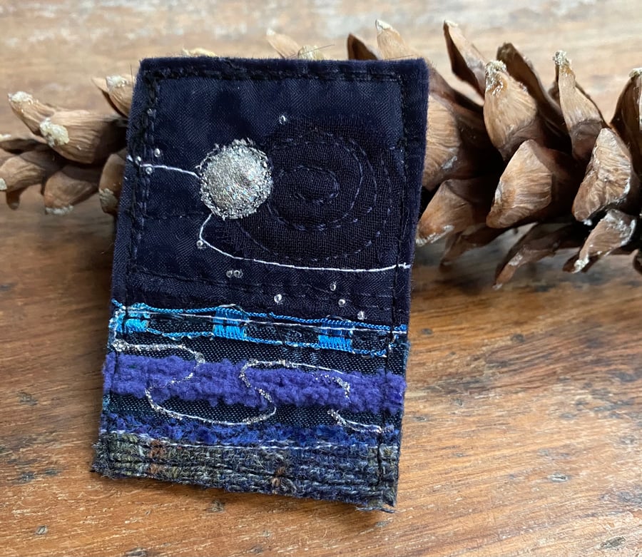Upcycled moon seascape brooch pin or badge. 