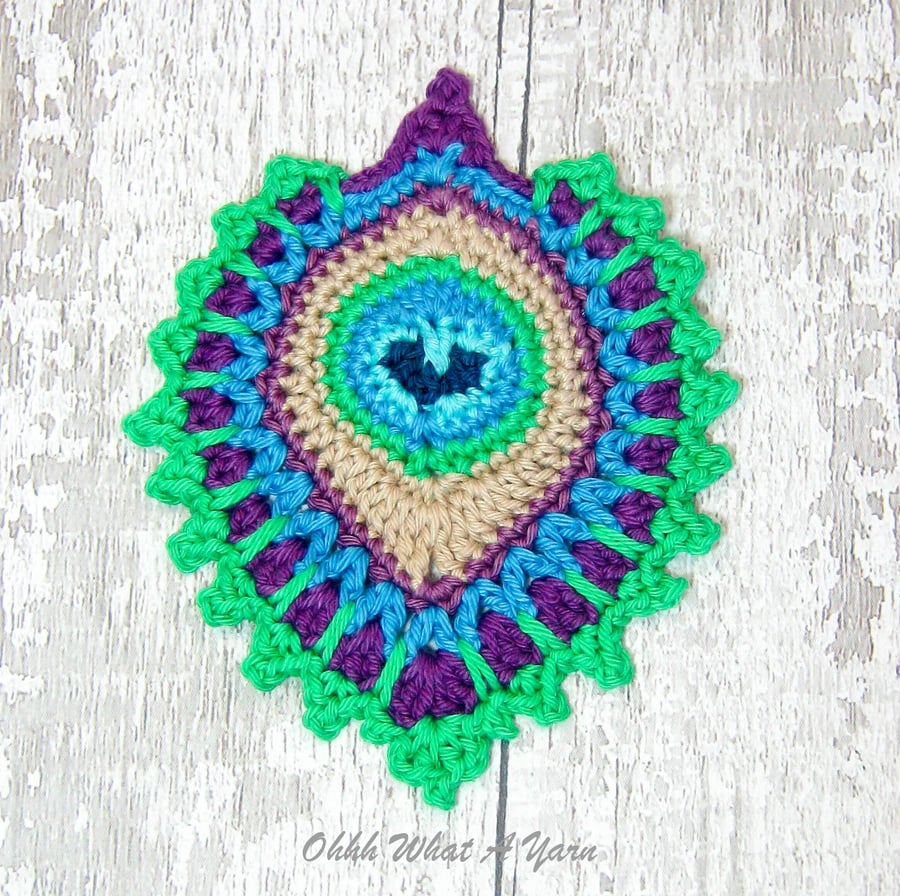 Peacock feather coaster, mat, in bright colours
