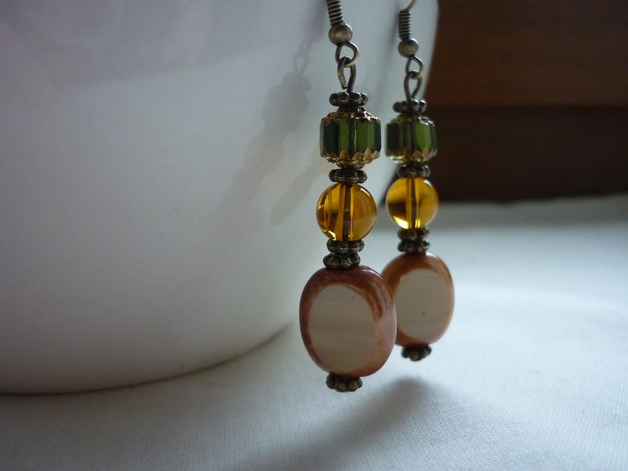 BEIGE, AMBER AND GREEN DANGLE EARRINGS.  769