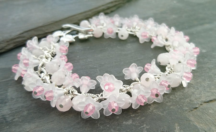 Pink and white flower bracelet with rose quartz beads and leaf toggle clasp