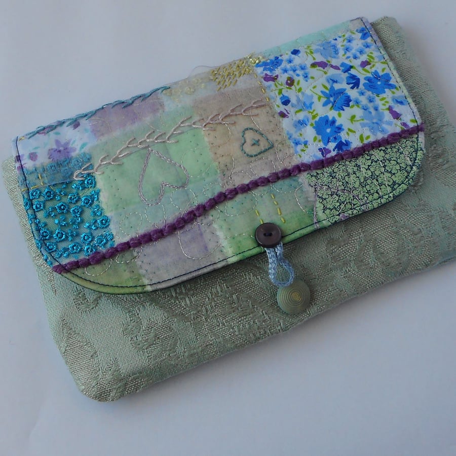Textile art clutch bag in soft colours