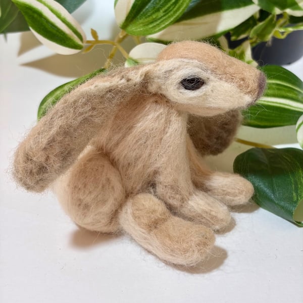 Bobby is a tan and  cream needle felted floppy eared hare