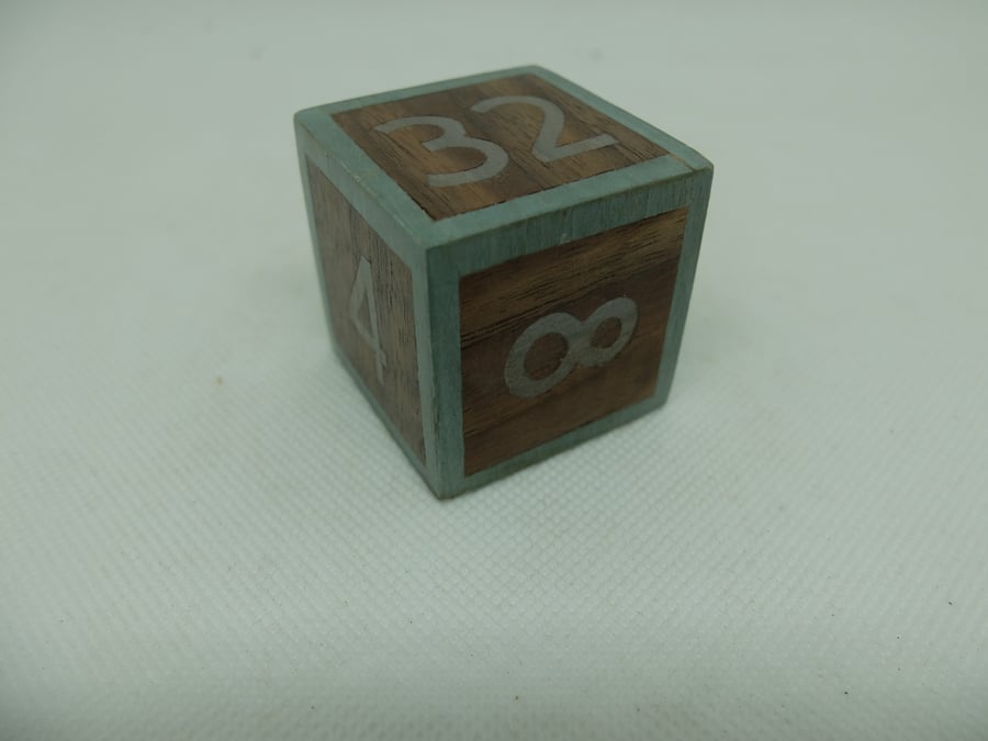 Mid blue veneered wooden doubling cube