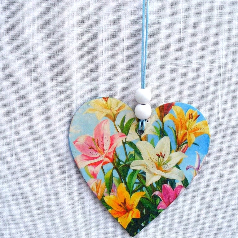 Lilies decoupaged wooden heart wall decoration.