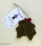 Holly leaf Christmas tree decoration.
