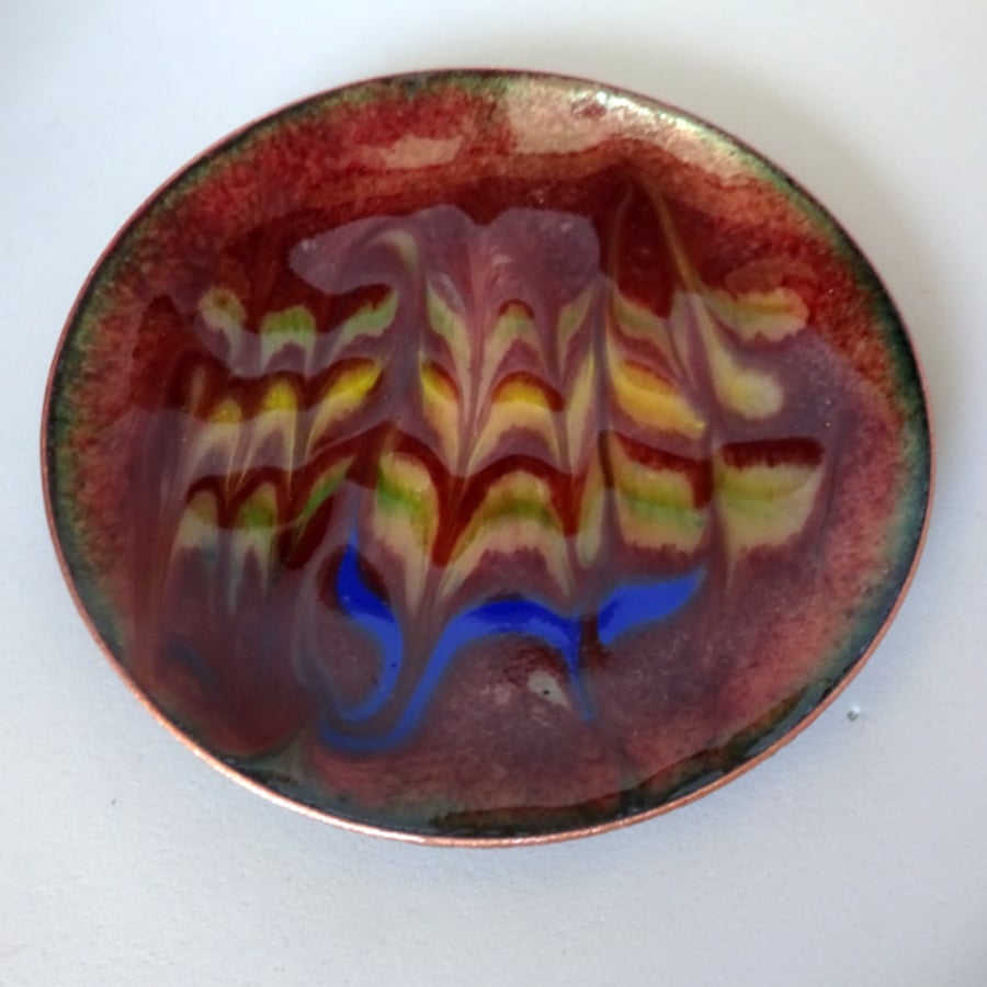 enamelled dish: scrolled gold, green, blue, on chestnut brown over clear