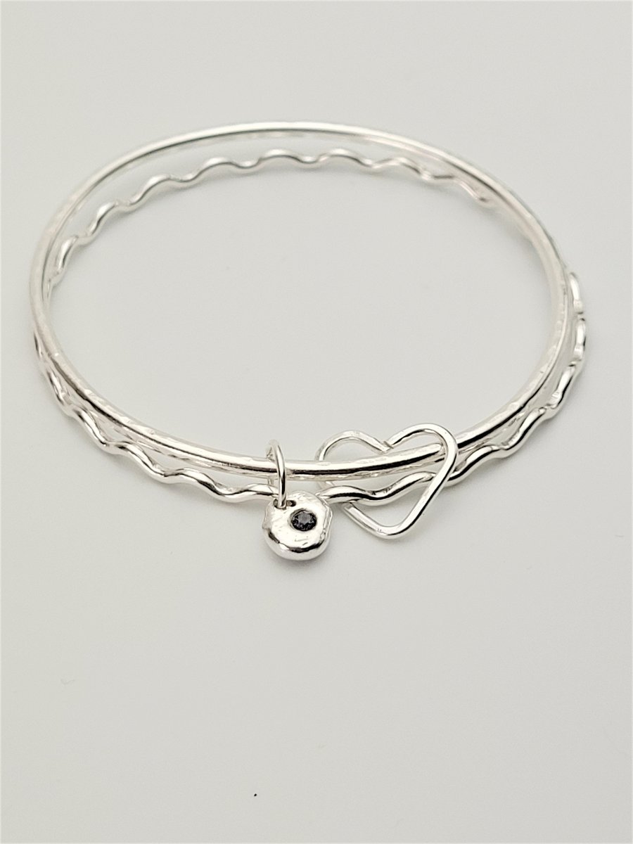 DOUBLE WAVE BANGLE WITH CHARMS
