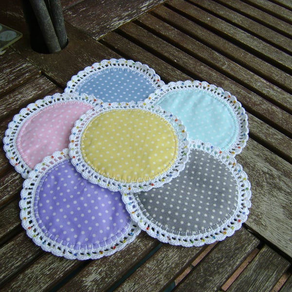 Pretty round polka dot fabric coasters.