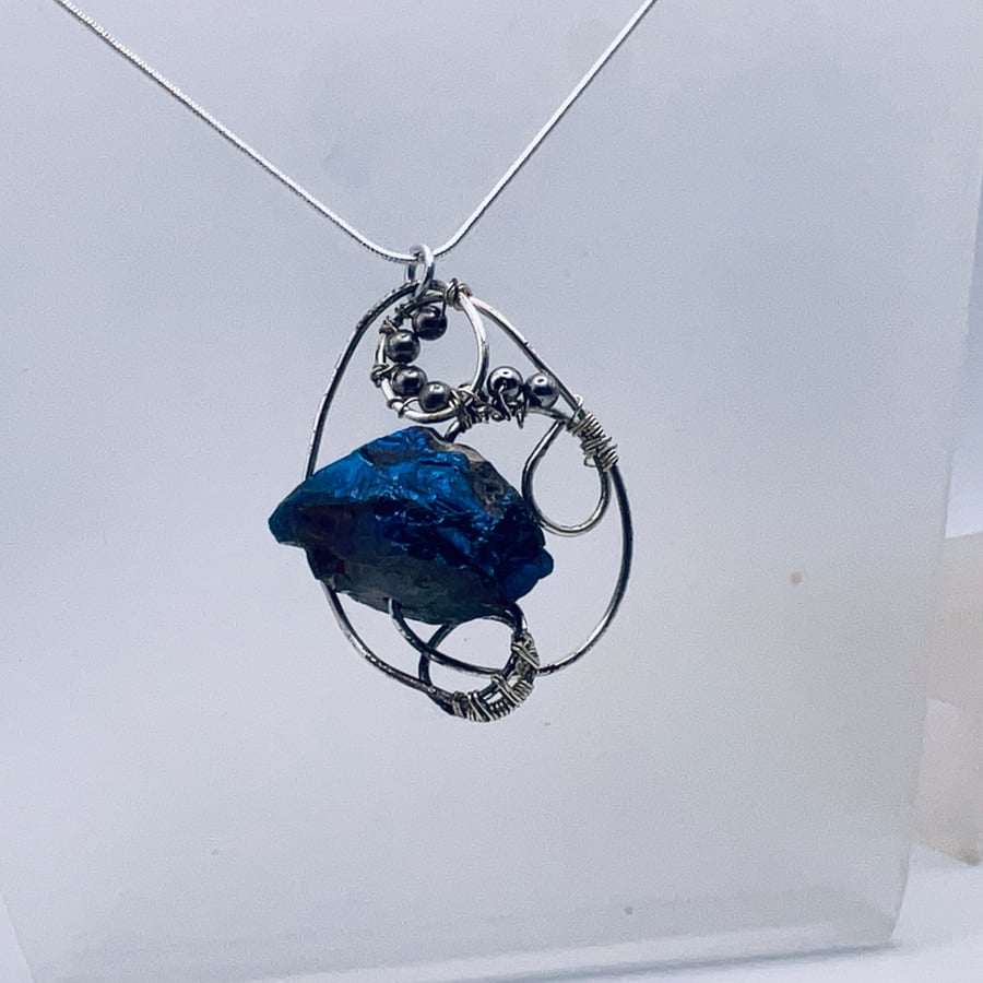 Rough hewn deep blue  gemstone pendant in silver