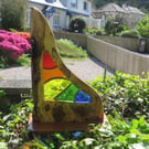 This is Parvos. A unique handmade stained glass and wood sculpture. 