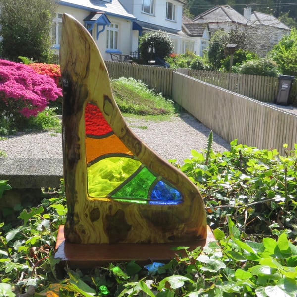 This is Parvos. A unique handmade stained glass and wood sculpture. 