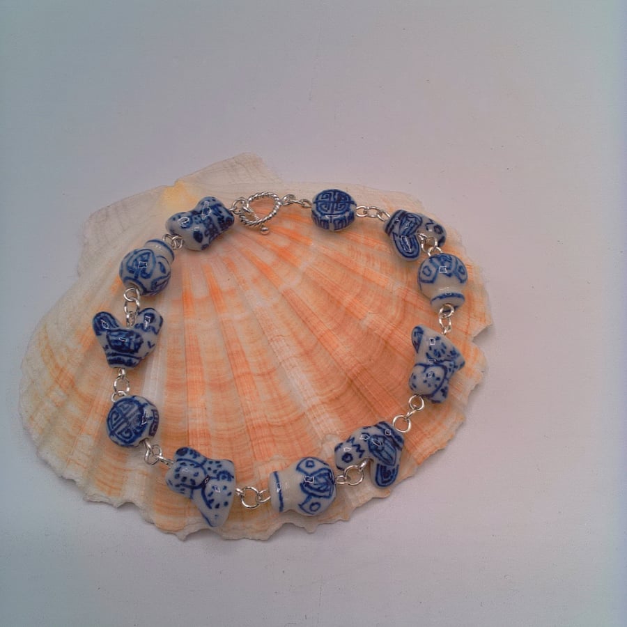 Bracelet and Earring Set Made with White Ceramic Beads with Blue Pattern