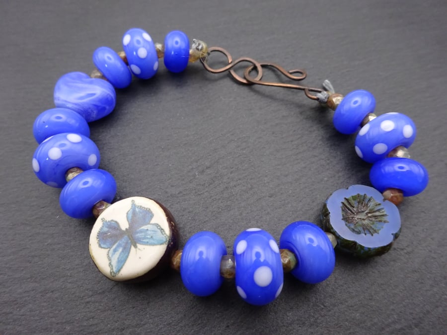 blue butterfly lampwork glass beaded bracelet