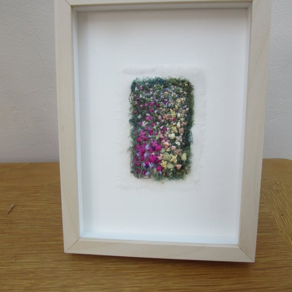 Garden picture.  Embroidered abstract summer flowers in light frame