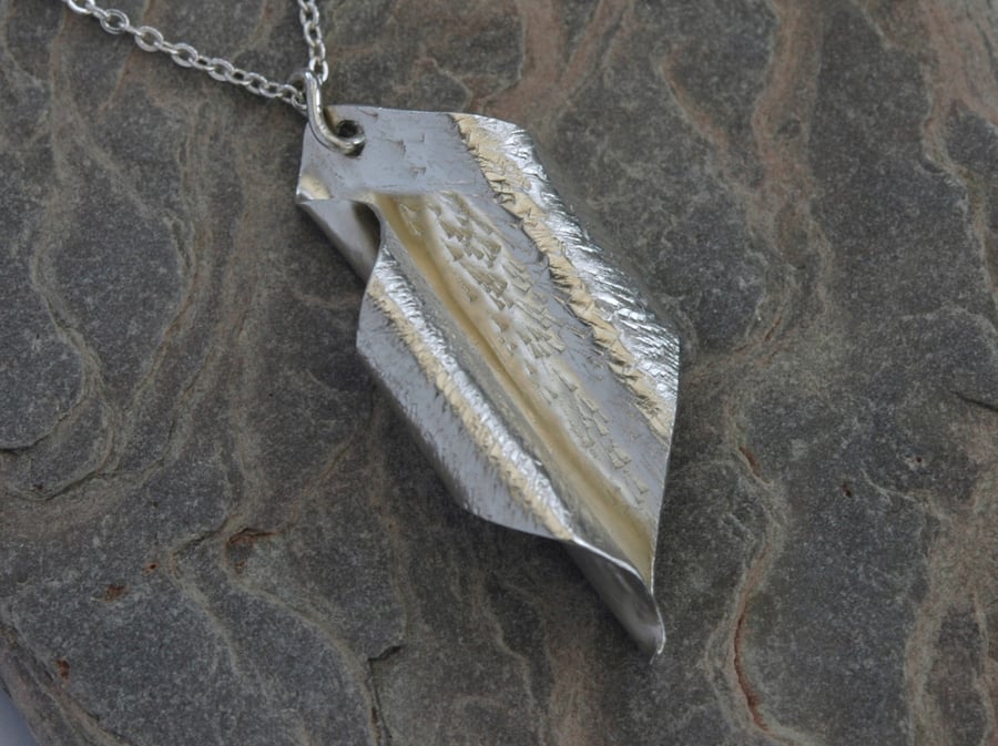 Scrolled leaf pendant in sterling silver,  hammered and hallmarked