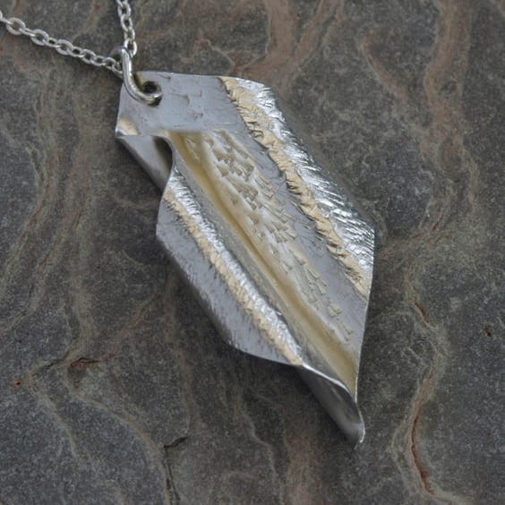 Scrolled leaf pendant in sterling silver,  hammered and hallmarked