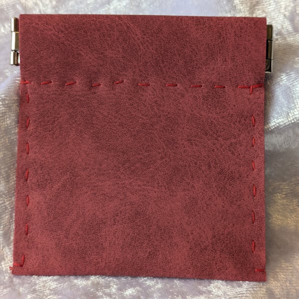 Red suede effect coin purse.