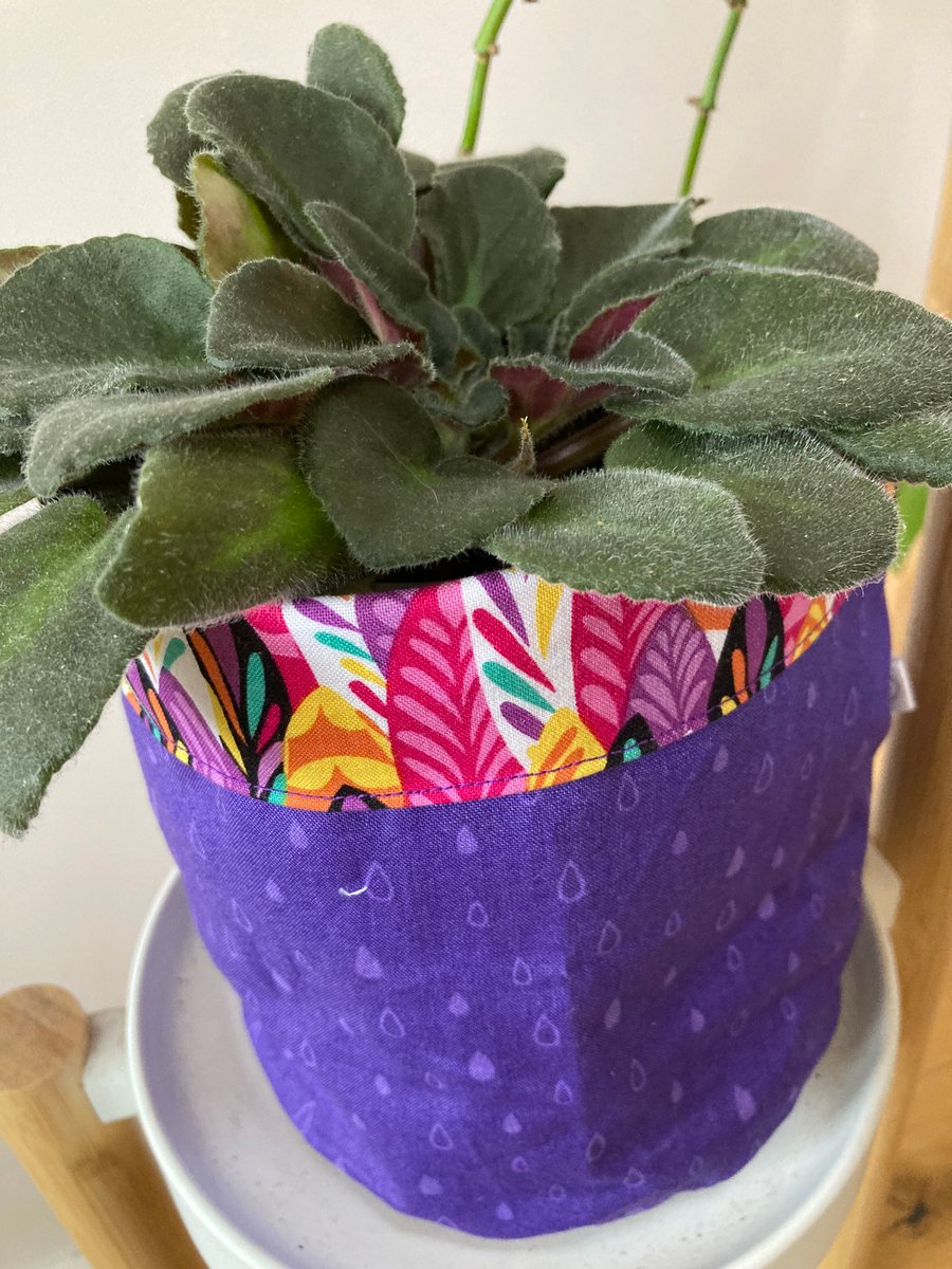 Large fabric storage basket or plant pot cover. Purple with colourful trim