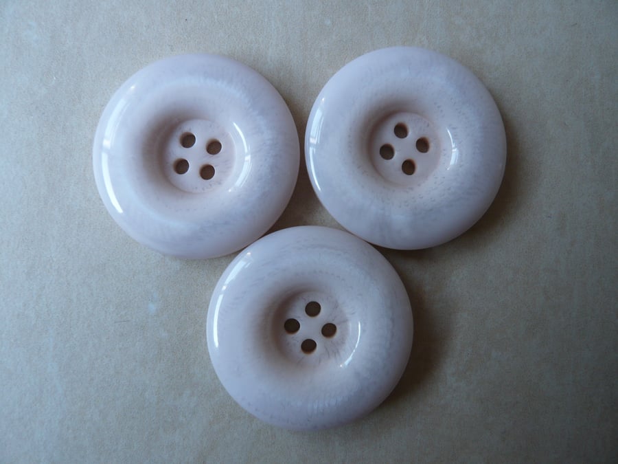 Three Cream Buttons