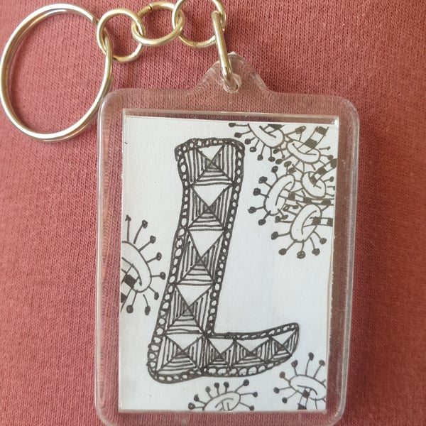 Hand drawn initial "L" keyring.