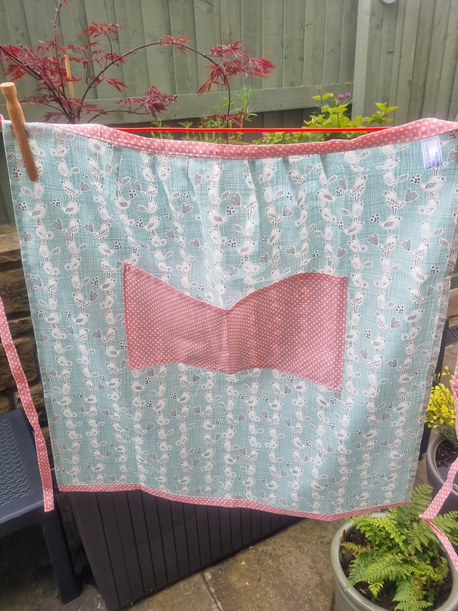 Half apron, sits on the waist.