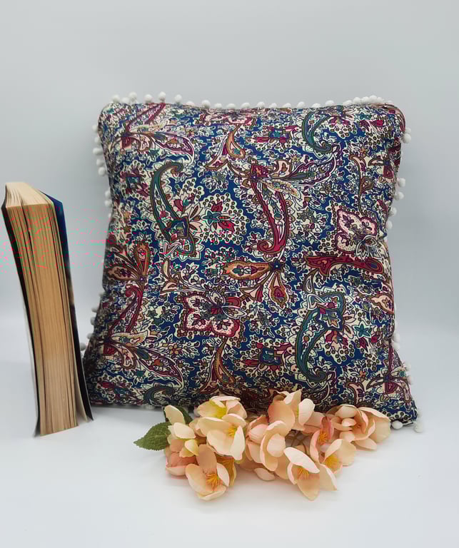 Cushion cover 14" in teal and cherry red pattern fabric. 