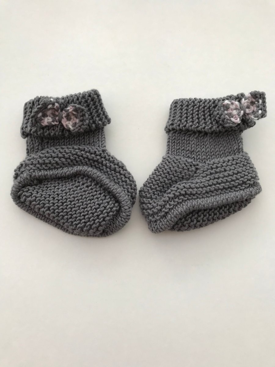 Hand knitted baby boots with bows