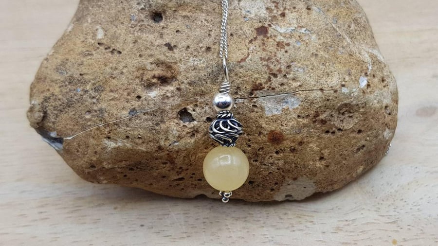 Small yellow calcite pendant. Reiki jewelry