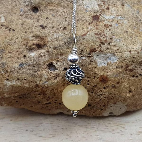 Small yellow calcite pendant. Reiki jewelry