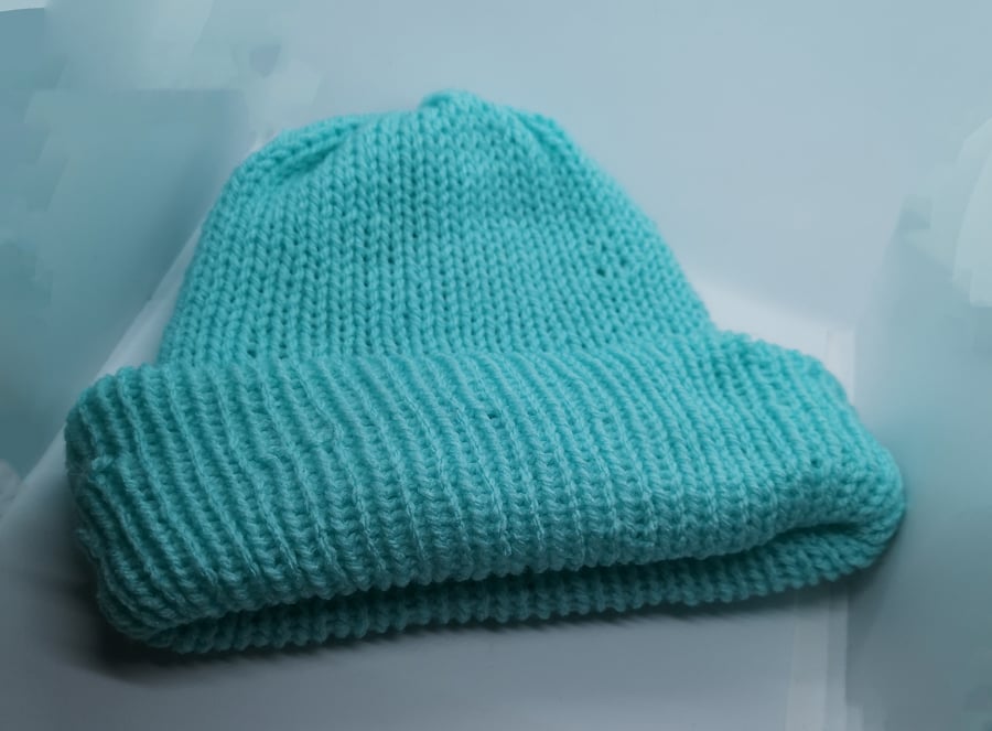 Handknitted turquoise hat