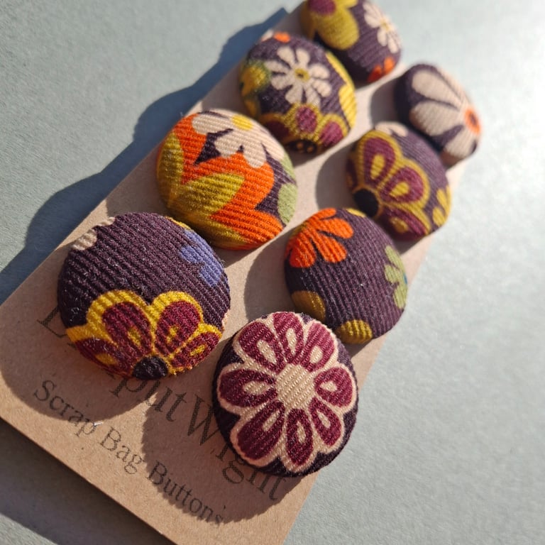 Set of eight scrap bag buttons -70's style floral needlecord fabric