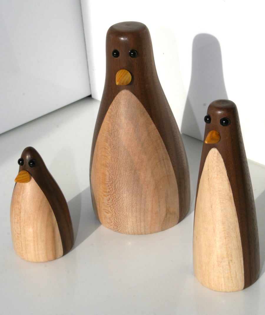 Wood turned family of three penguins 