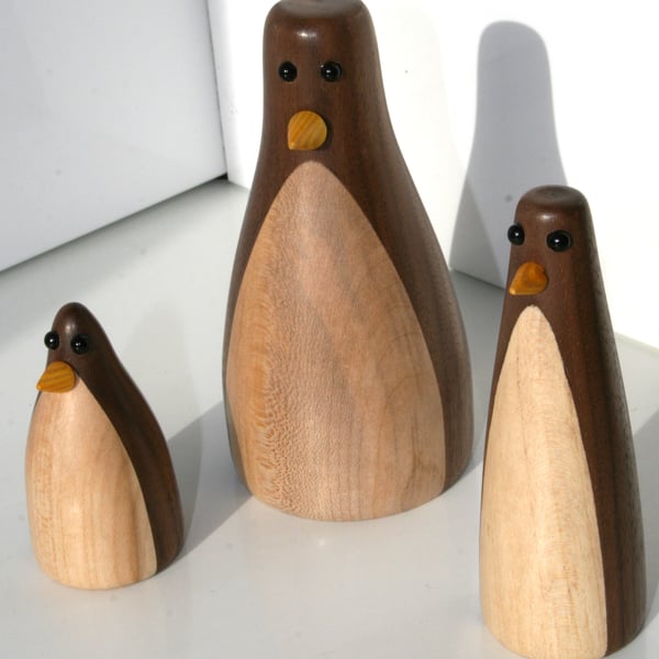 Wood turned family of three penguins 
