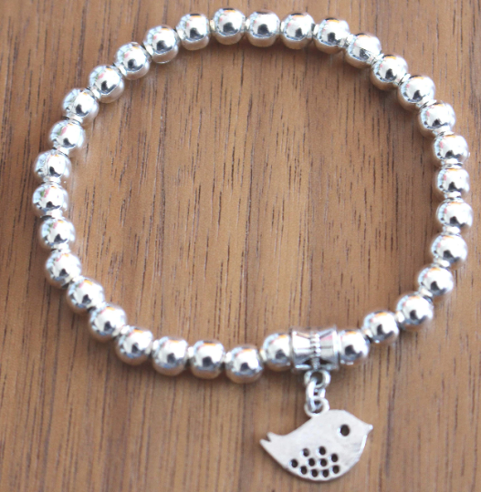 Silver Beads Stretchy Bracelet With Bird Charm