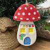 Ceramic toadstool Christmas decoration red roof blue door
