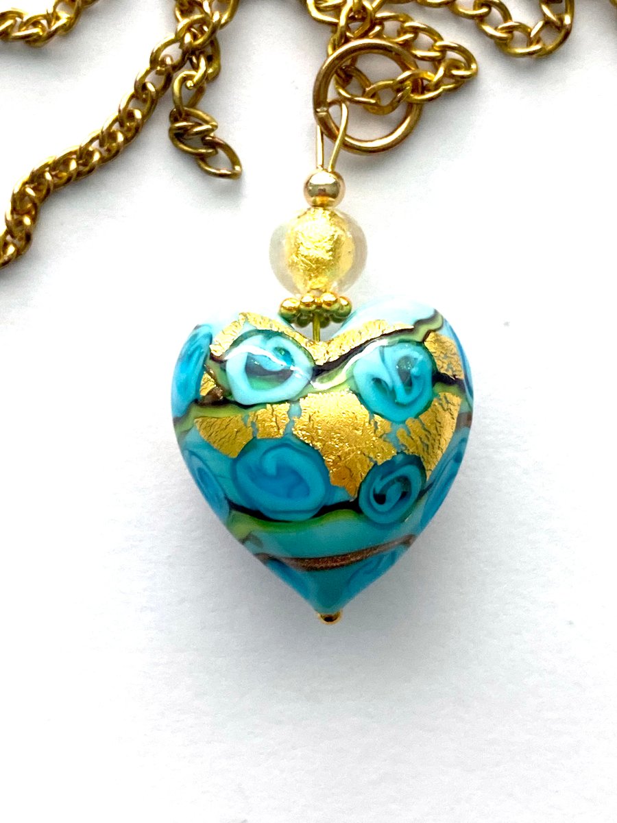 Murano glass pendant with aquamarine blue and gold Murano bead and gold chain.