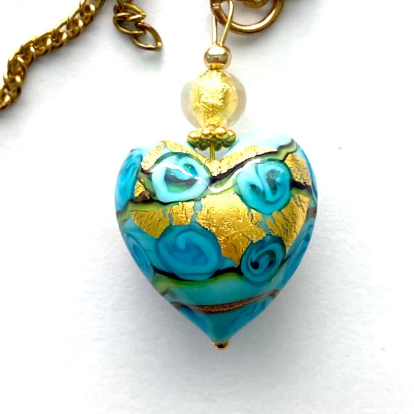 Murano glass pendant with aquamarine blue and gold Murano bead and gold chain.
