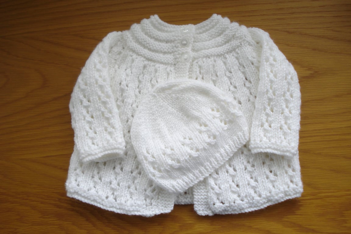 Hand Knitted Baby Jacket And Hat In A White Sparkle Yarn (AJ52)