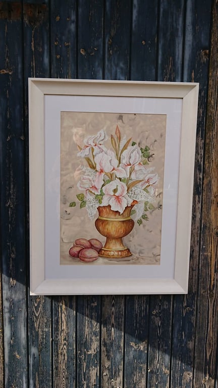 white iris in copper urn with plums.